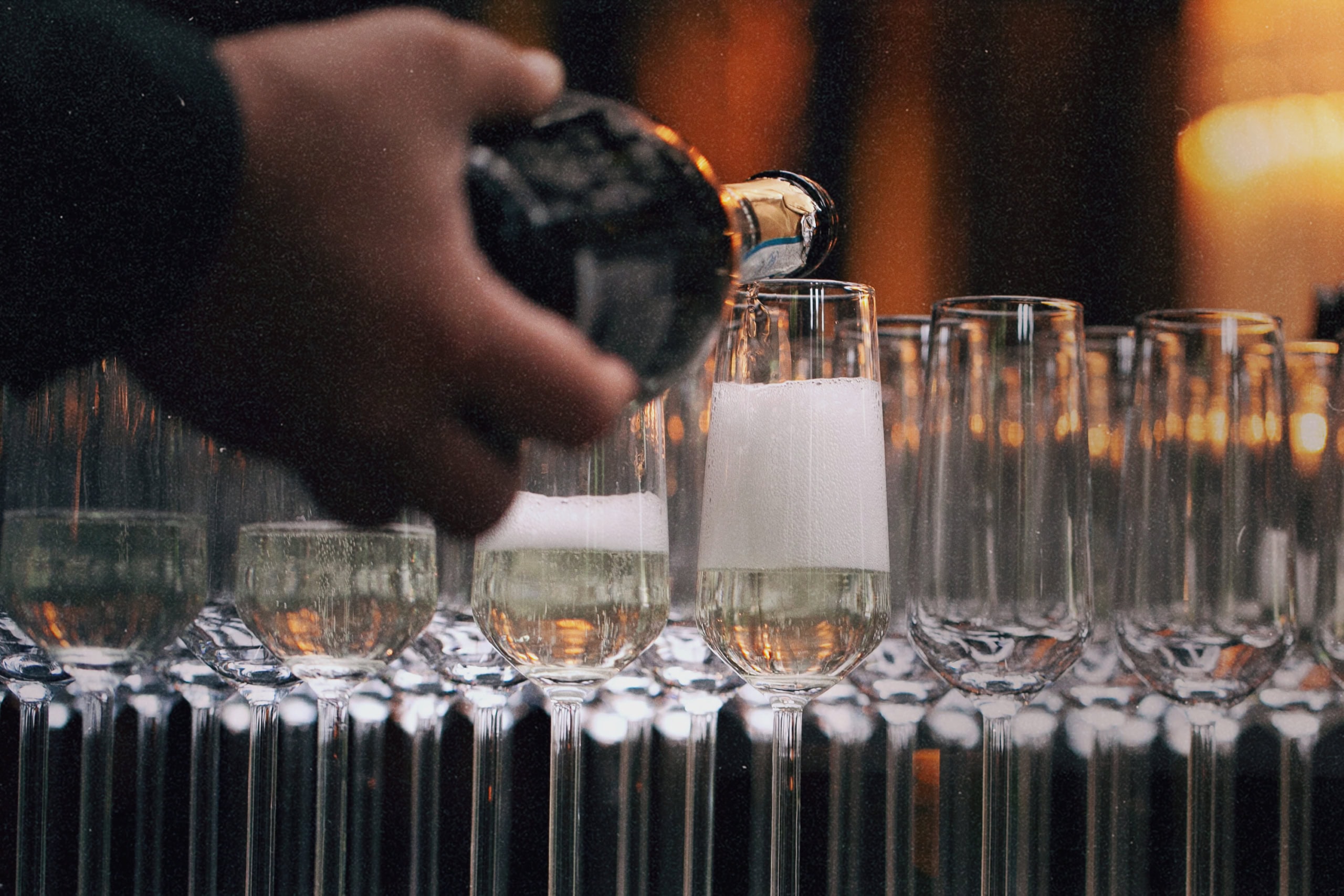 Wedding celebration with guests toasting, provided by Golden Service Mobile Bar, offering bar and catering services in Halifax for weddings and events.